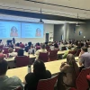 photo of large lecture hall filled with audience members listening to speaker Erika Hamden at TIMESTEP's internship symposium in September 2025